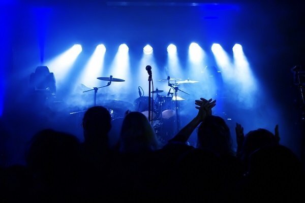 Band on stage with blue lights.