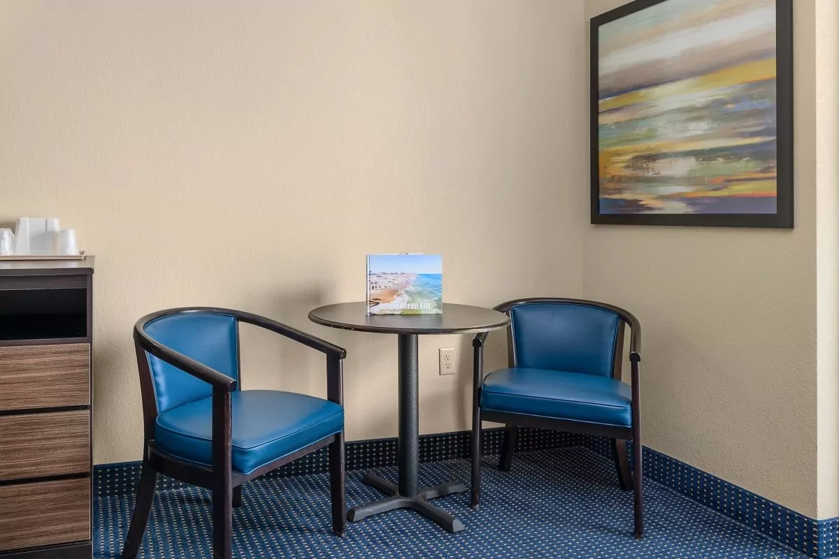 a room with two chairs and a small table